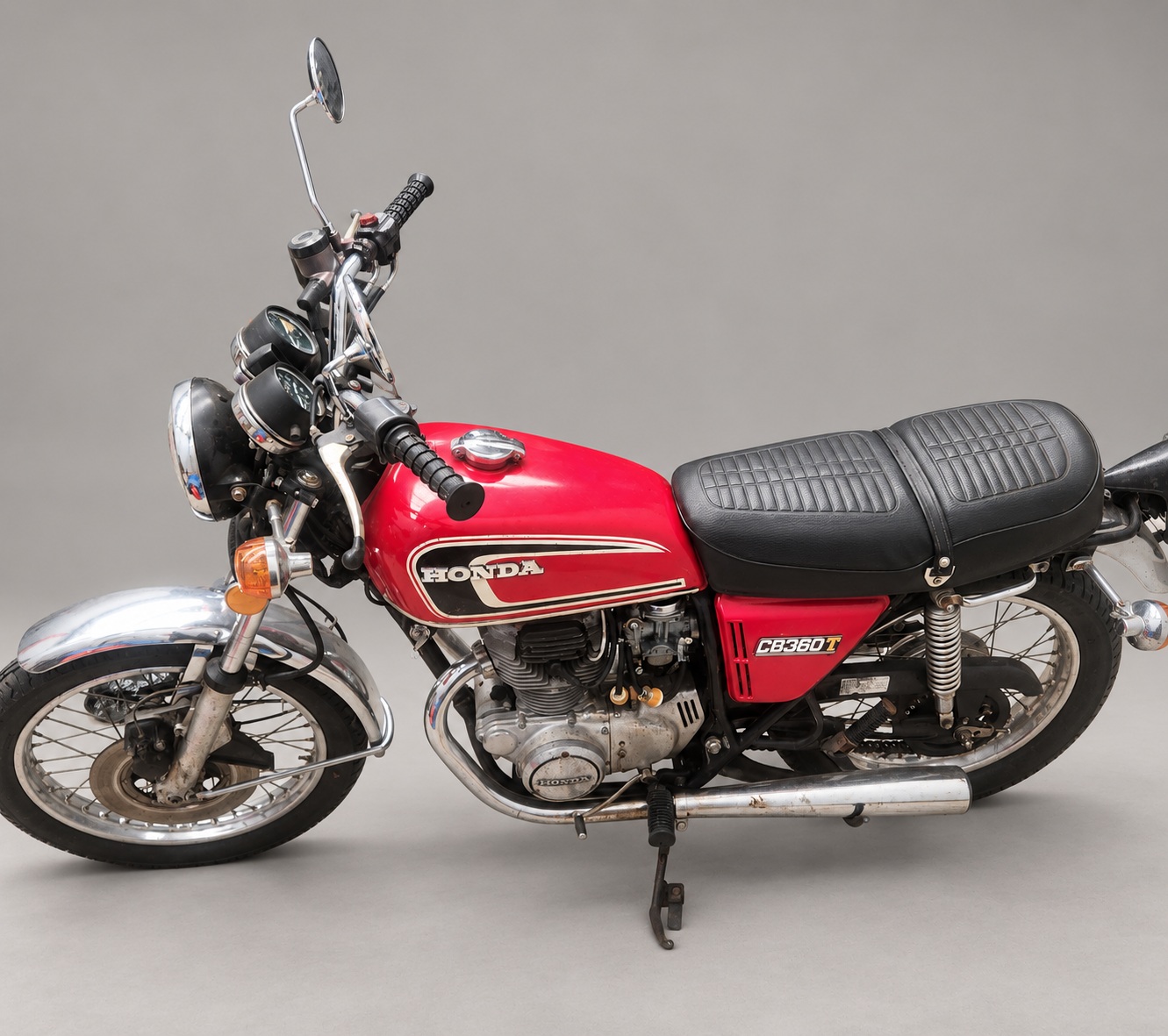 Red 1975 Honda CB360T — Left side, elevated view