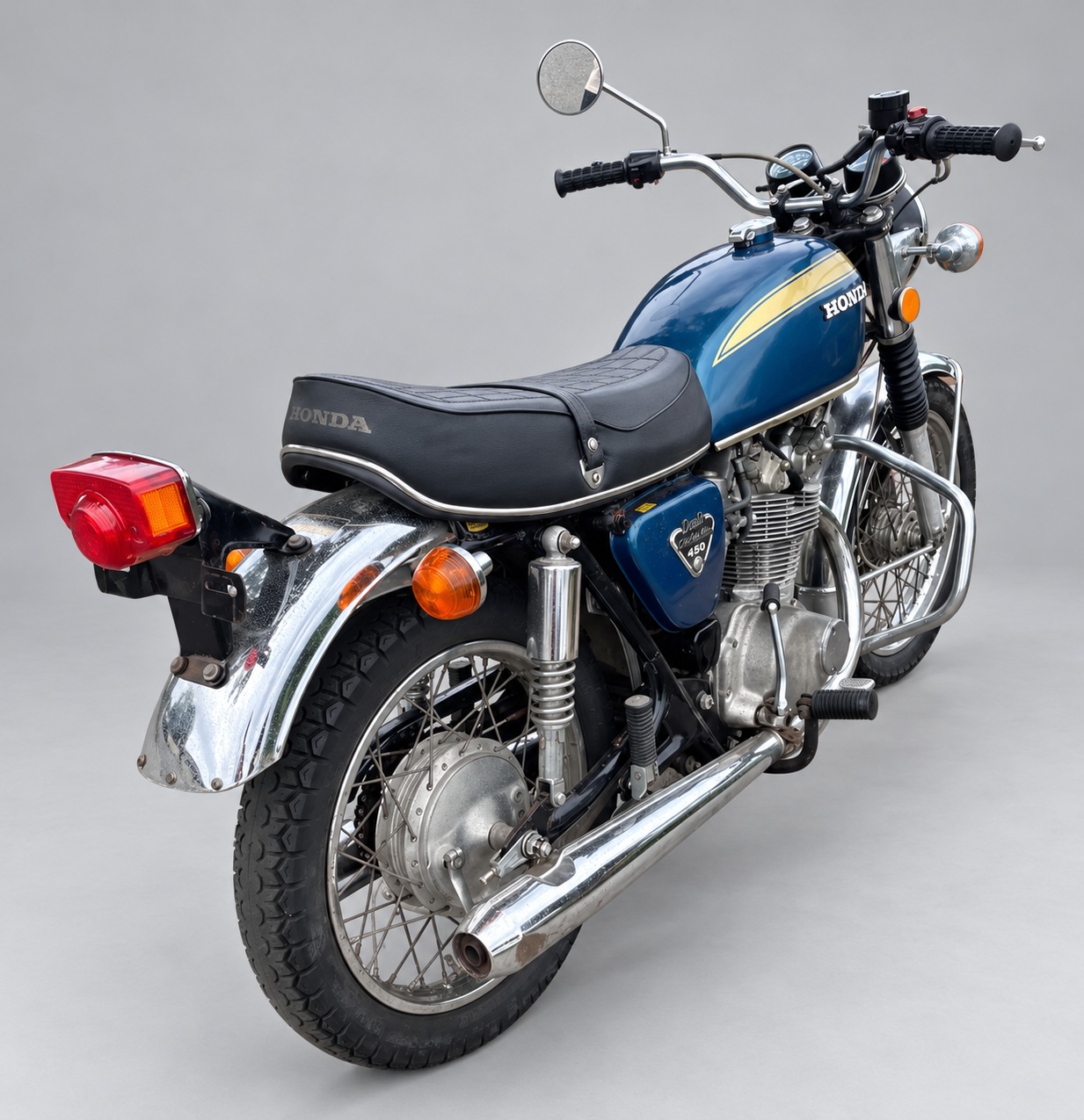 Blue and gold 1972 Honda CB450 — Rear right three-quarter view